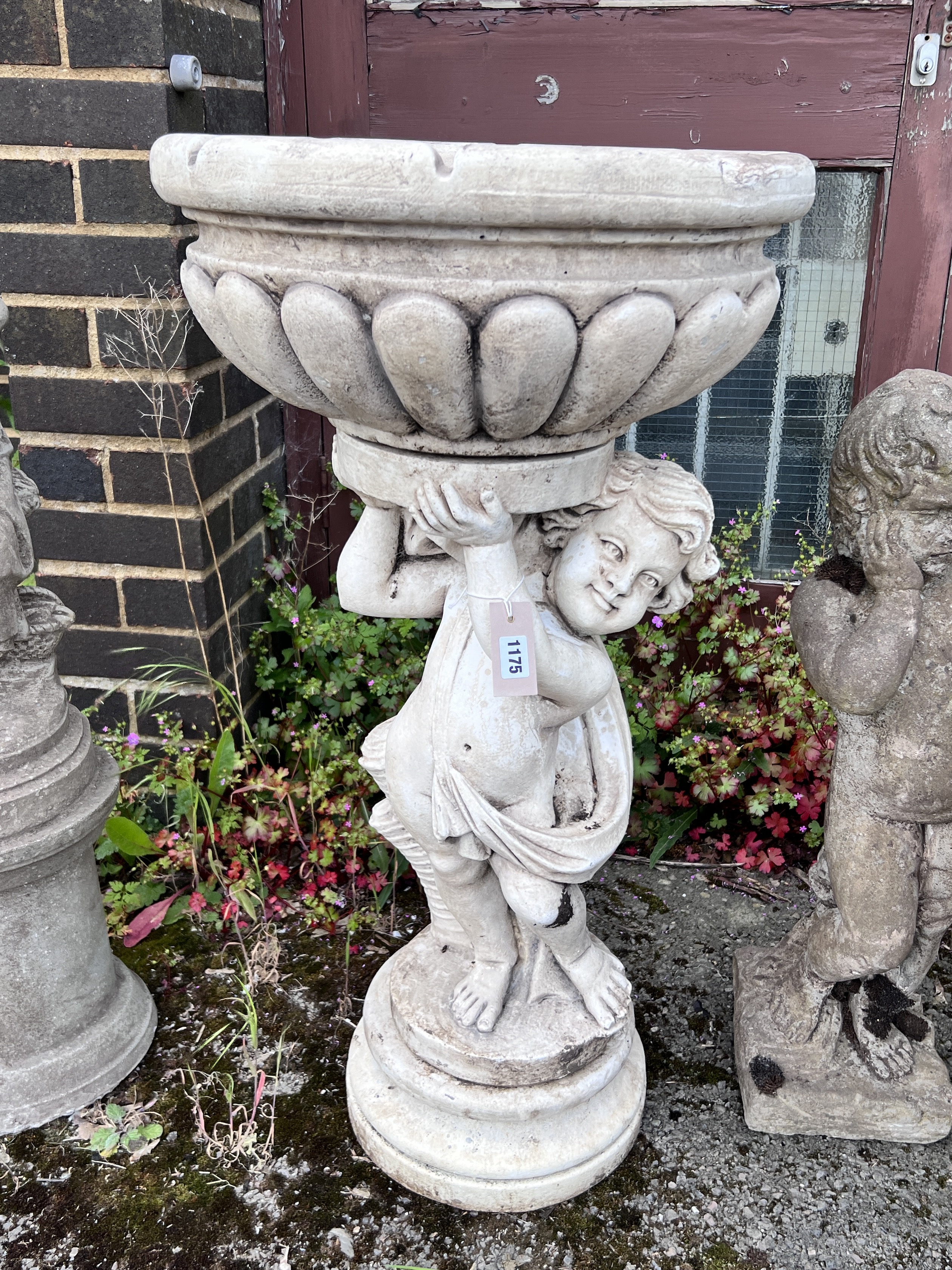 A faux marble cherub garden fountain, height 90cm